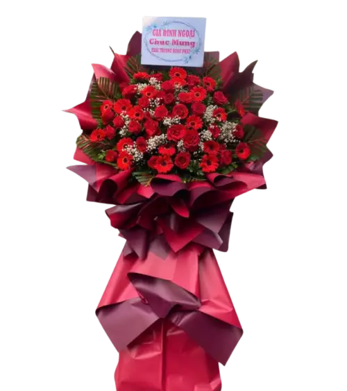 Kệ hoa khai trương đỏ cúc đồng tiền kèm bảng chúc mừng