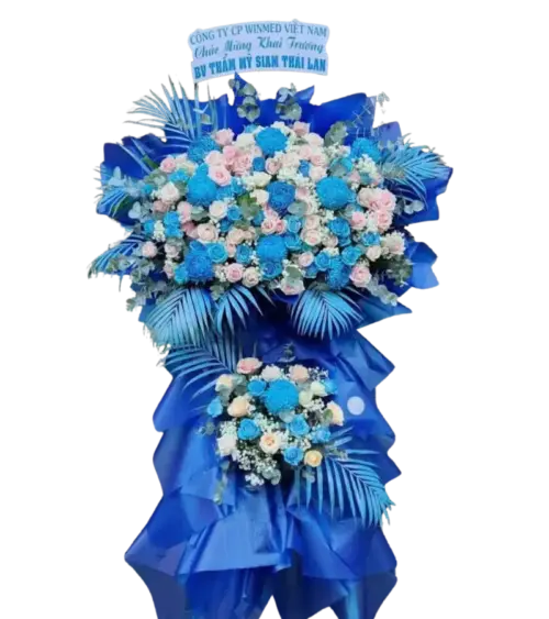 Kệ hoa khai trương xanh dương phối hồng kèm bảng chúc mừng