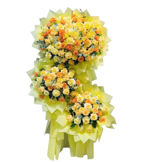 Kệ hoa khai trương vàng cam 3 tầng bọc giấy vàng chanh